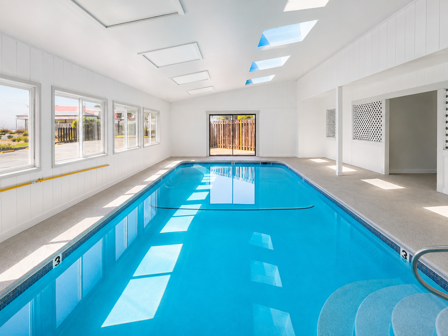 Seabird Lodge indoor heated swimming pool in a bright room with skylights